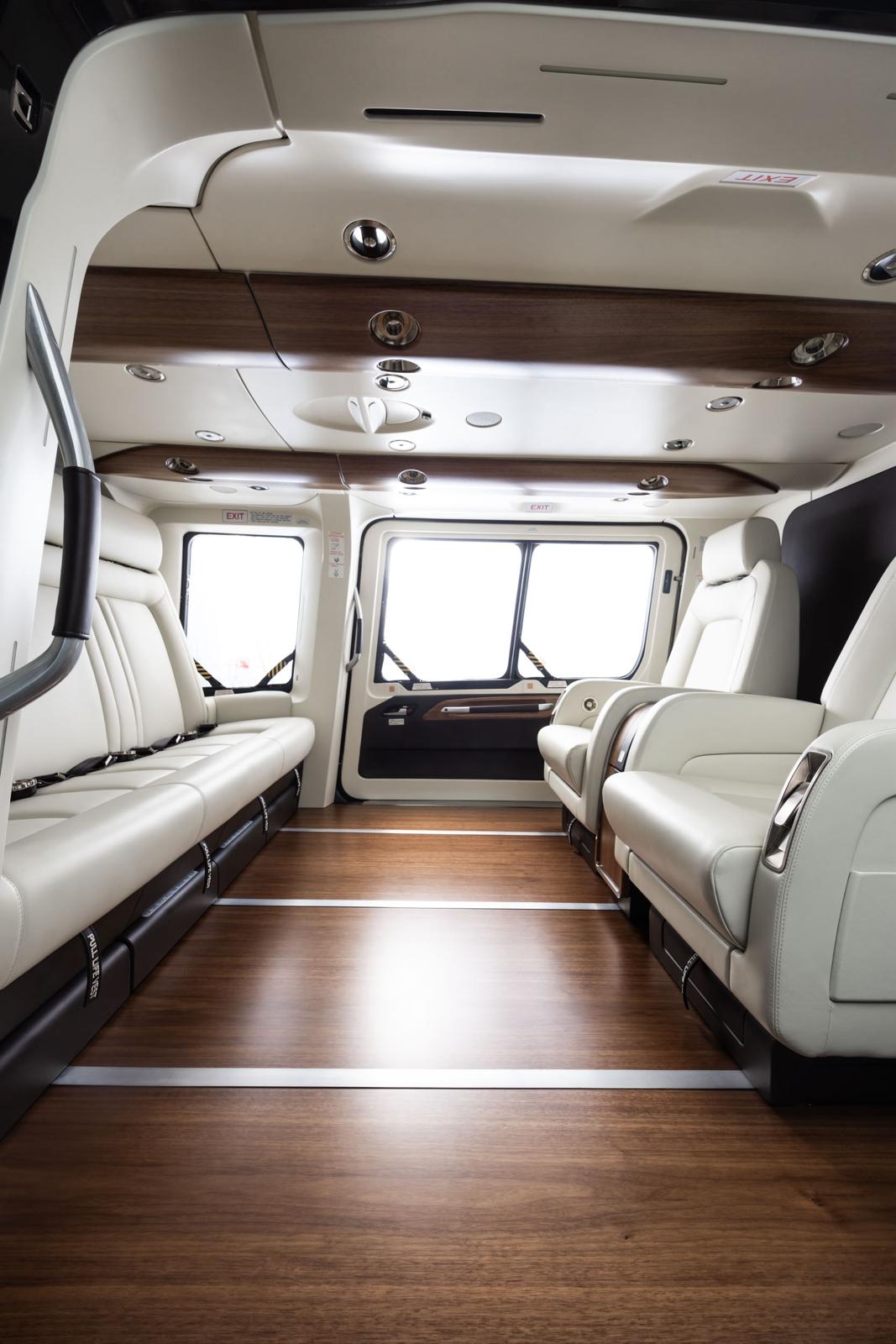ACH160 lounge cabin with cream leather seating and wood floor